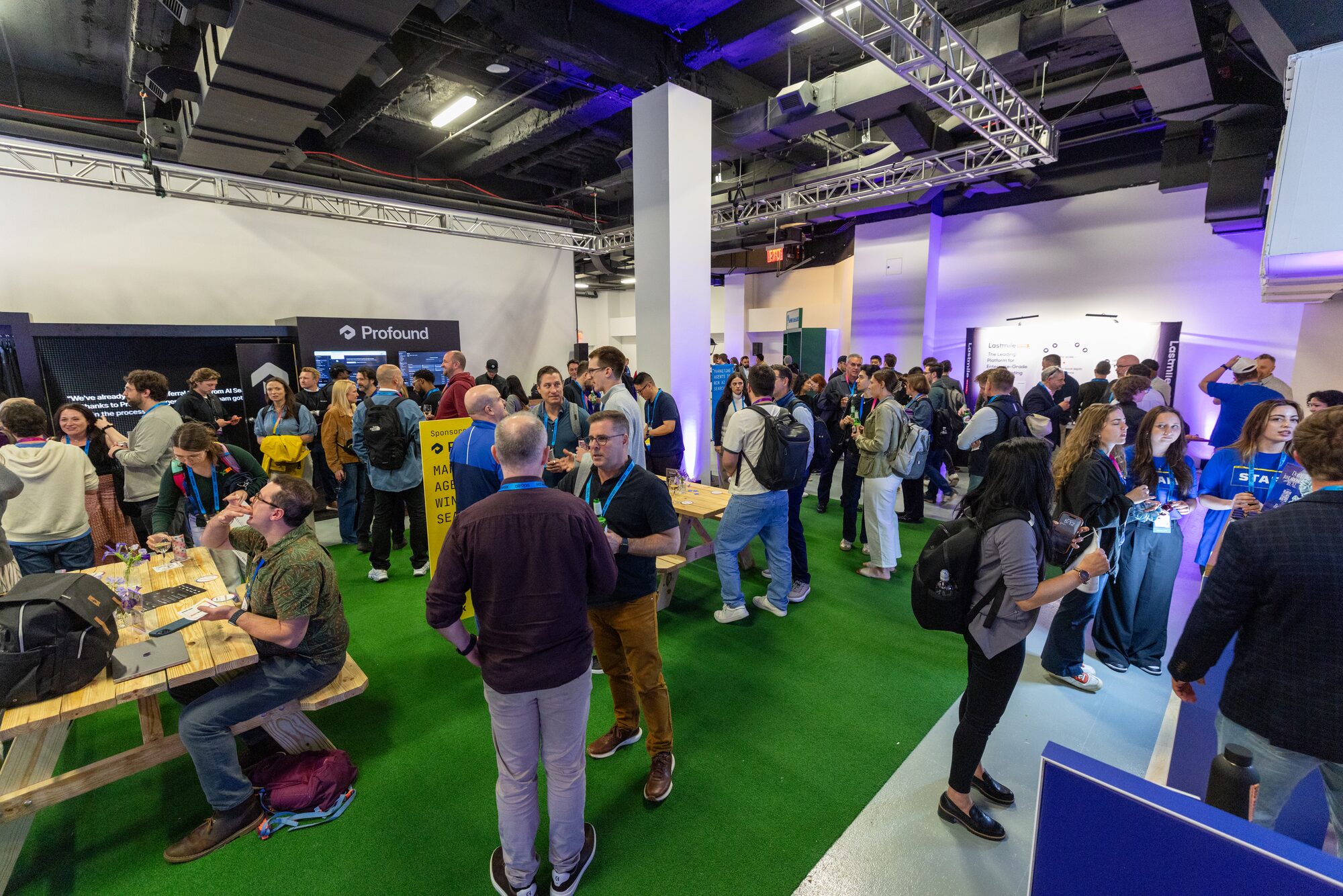 Crowded expo floor with attendees networking between sessions