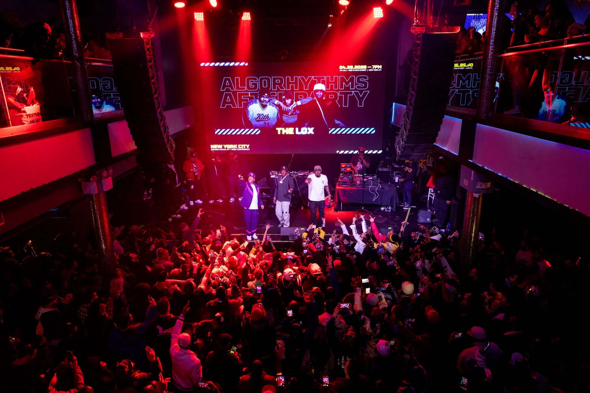 After-party concert crowd under red stage lights