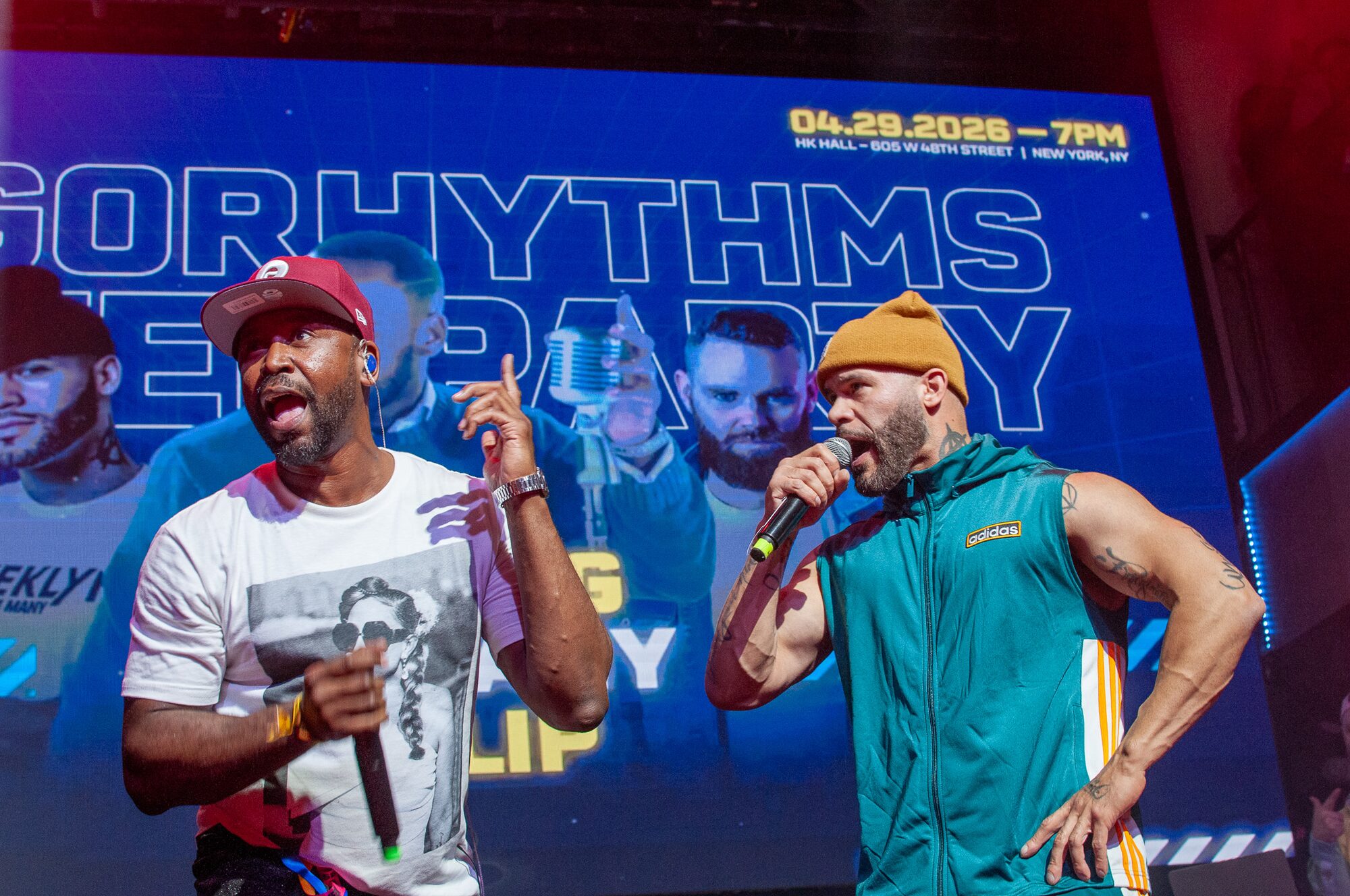 Two performers on stage at the after-party